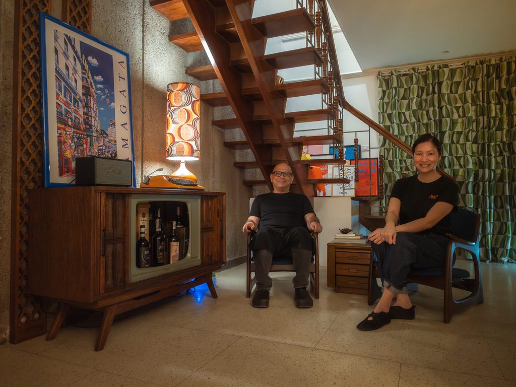 Chef Nats and Ethel in the mid-century living room with vintage furniture and staircase