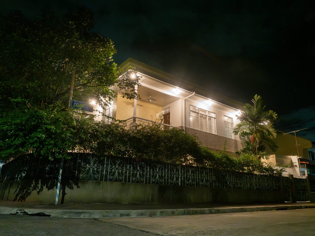 61 Orange heritage home exterior at night with warm lighting
